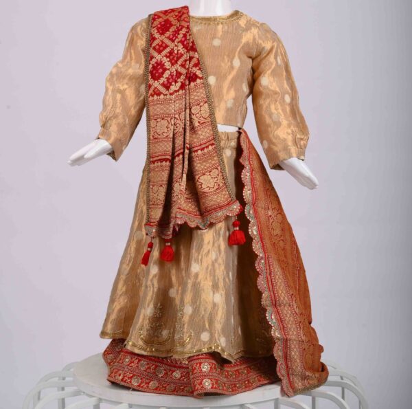 golden lehenga with bandhej dupatta