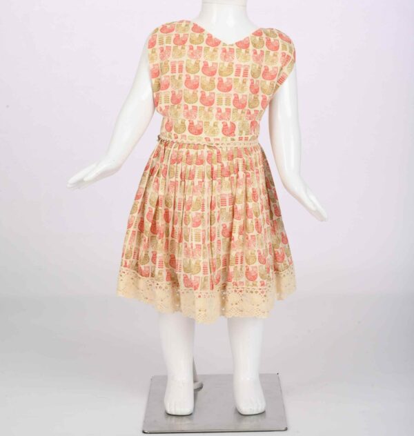 orangish duck print dress with crochet lace