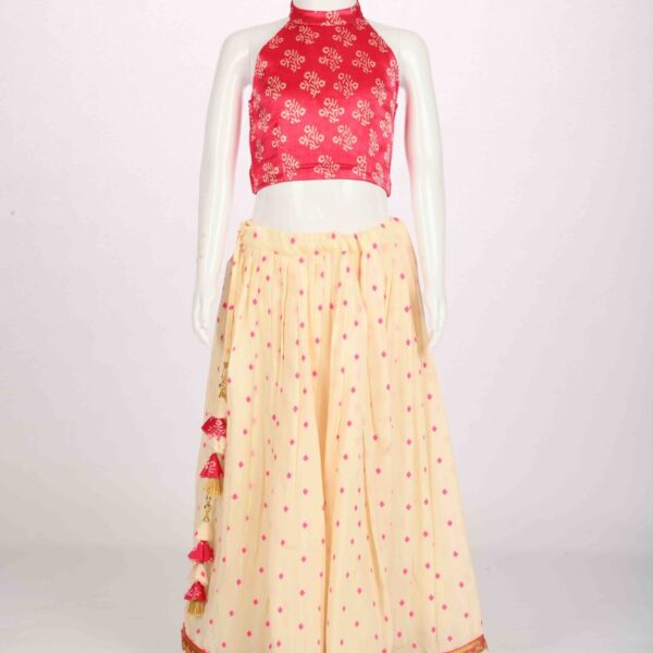 off white lehenga with pink halter blouse